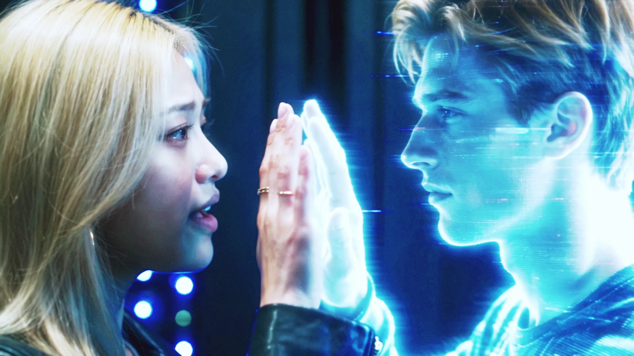 Ivy from AI (KO) pressing her palm against a glowing hologram of the user, separated by static, in the OFFLiNE music video
